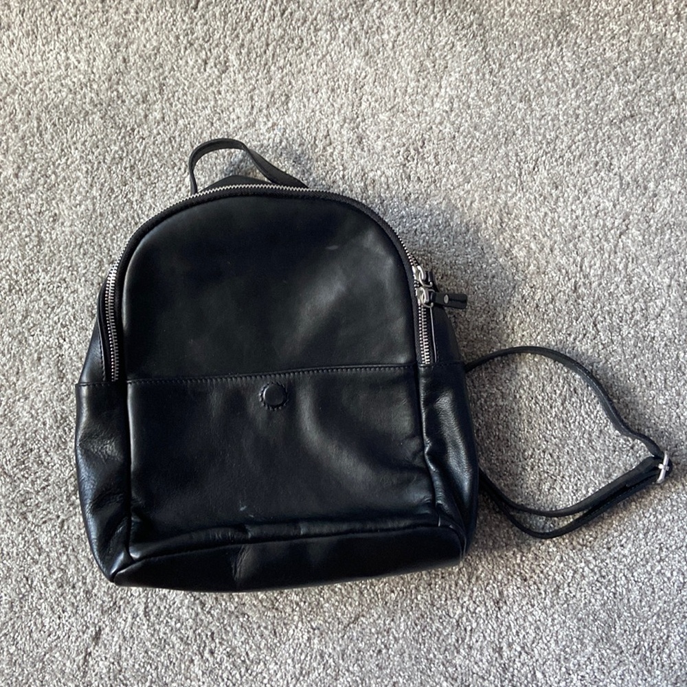 Mini black backpack. Pretty spacious